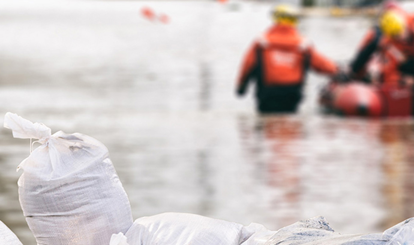 Rescue workers in a flooded area